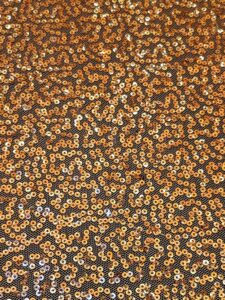 Tulle Sequins Table Linen - 136 Inch Round - Rose Gold closeup photo